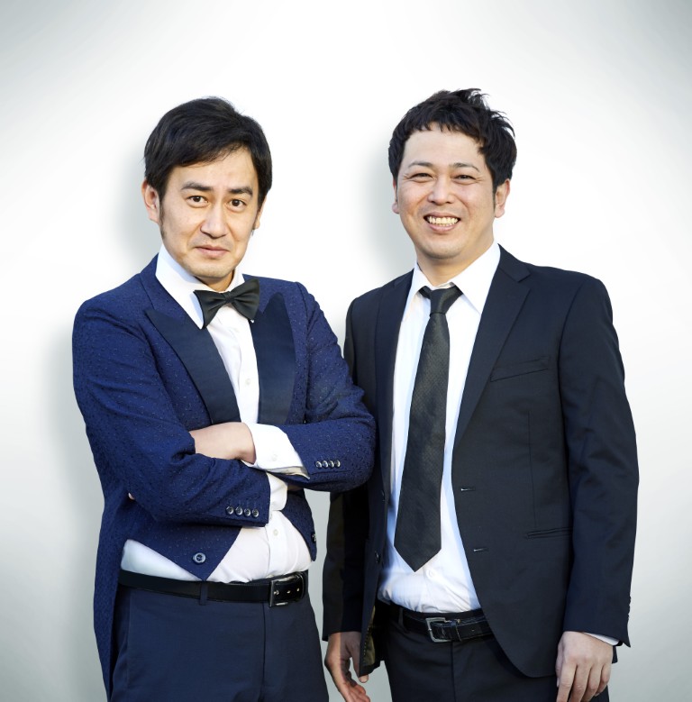 An image of Da-rinzu. On the left is Rinsu Matsumoto, and on the right is Yuichiro Oda.
